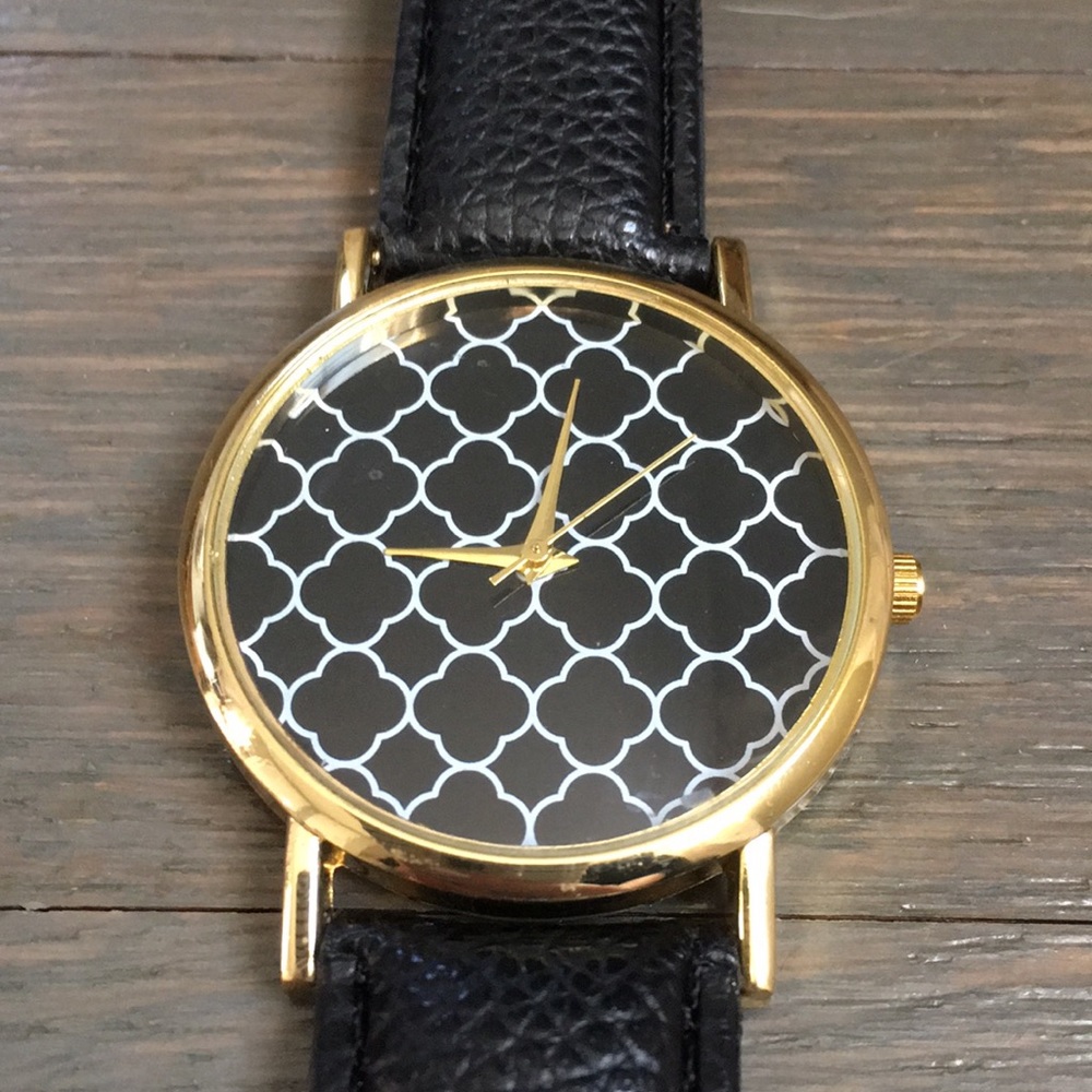 Beautiful Black Watch with white and gold pattern